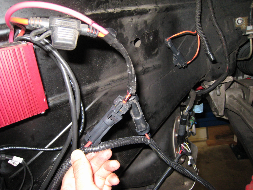 Boost-a-pump connectors plug in-line into the Racetronix Hotwire harness. And then the old fuel wire connectors just plug back into each other.